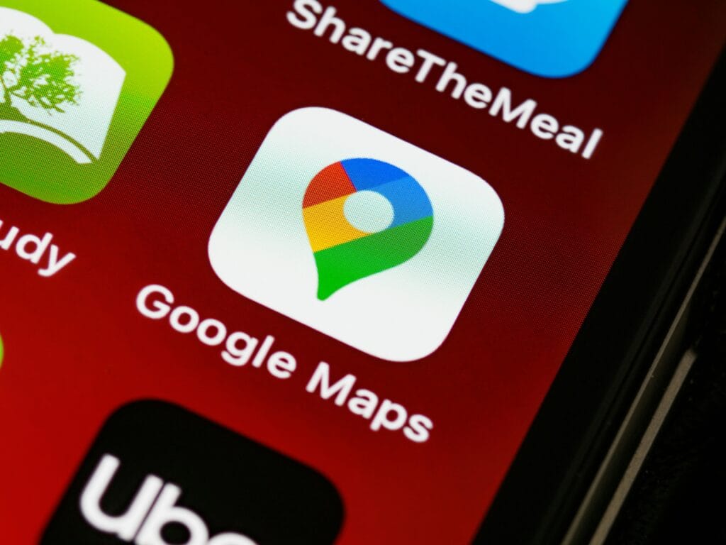 Google Maps app icon on a smartphone screen representing local SEO, proximity factors, and Map Pack rankings for real estate agents.
